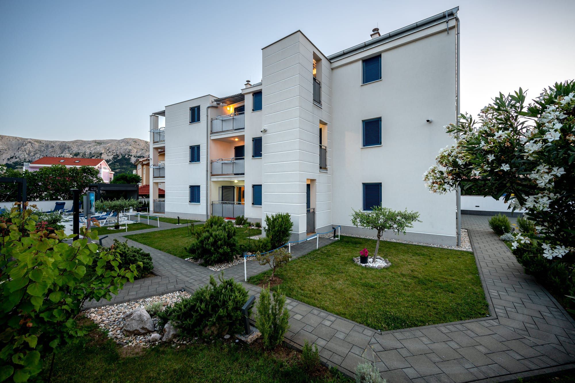 Adorami Apartments building and garden